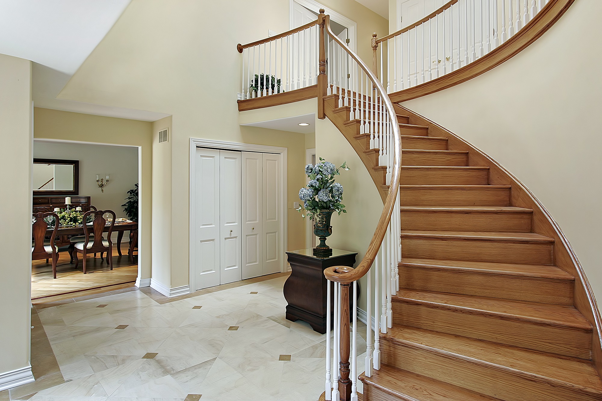Foyer With Curved Staircase
